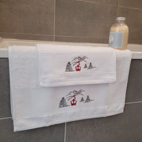 White bath towel with red cable car