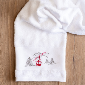 White bath towel with red...